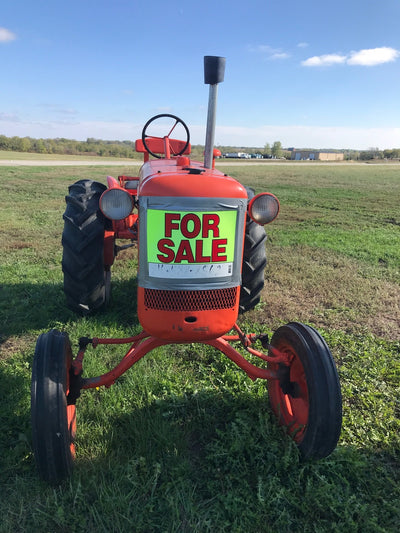 For Sale Sign on Farm Equipment